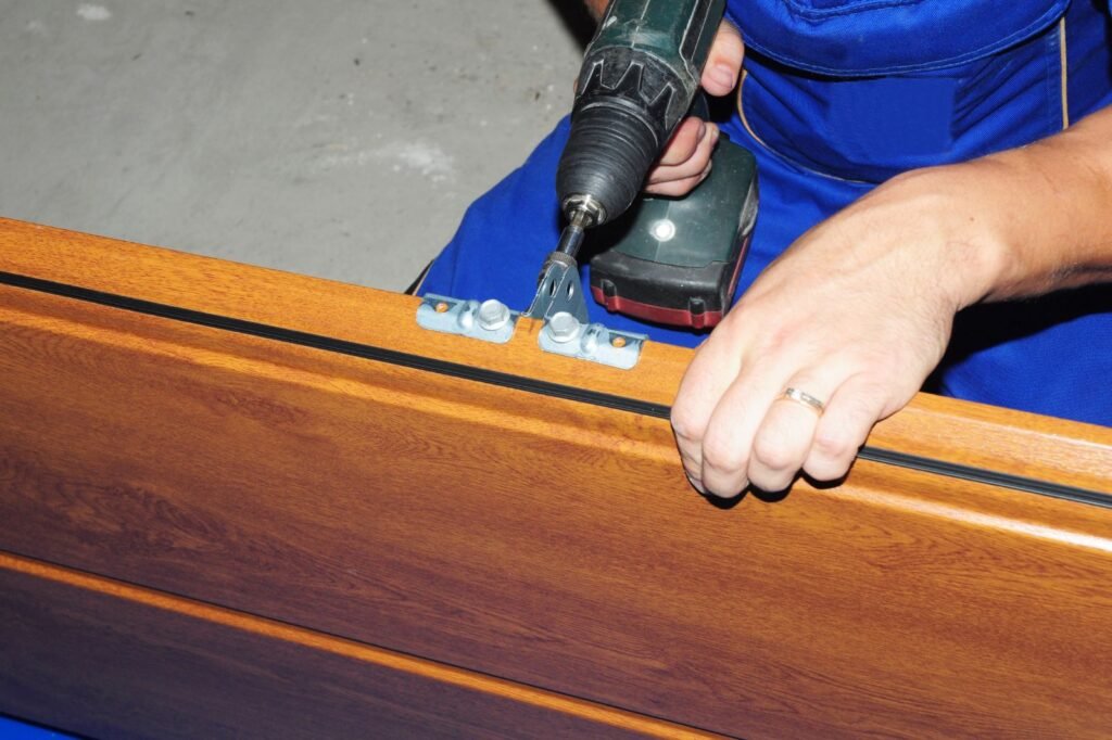 Technician installing reinforcing panel on residential garage door in Spring Valley NV